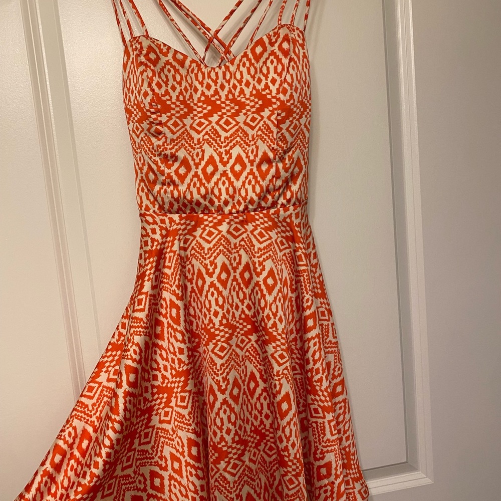 Occasion dress in coral and white. Silk feel